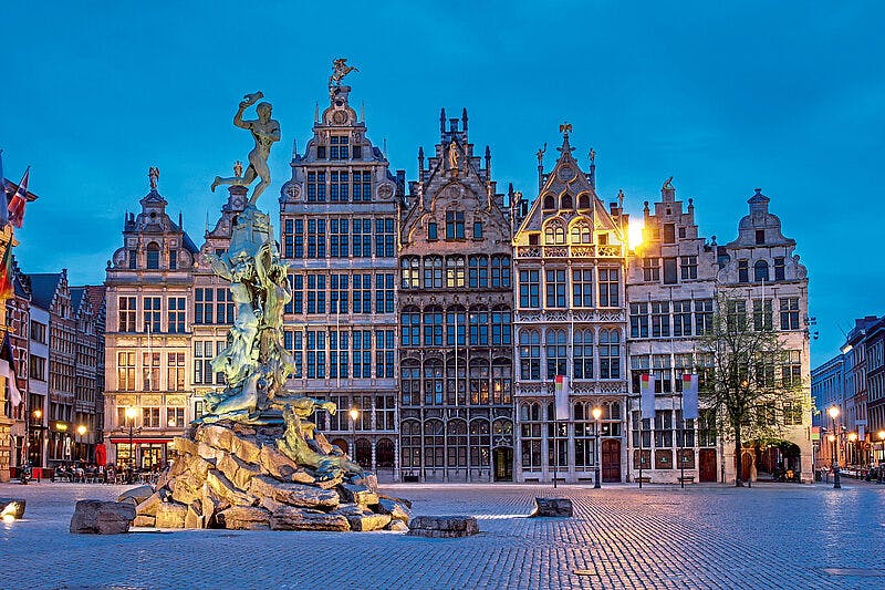 Image of Grote Markt in Antwerp with a sculpture in front of it.